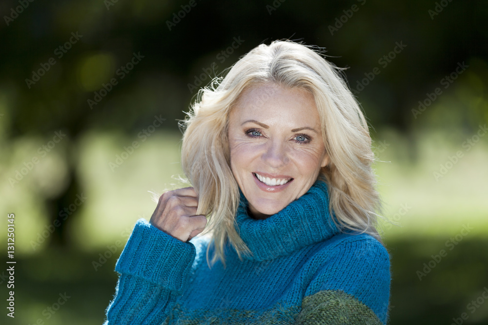 Portrait Of A Mature Woman Smiling At the Camera At The Park Portrait Of A Mature Woman Smiling At the Camera At The Park