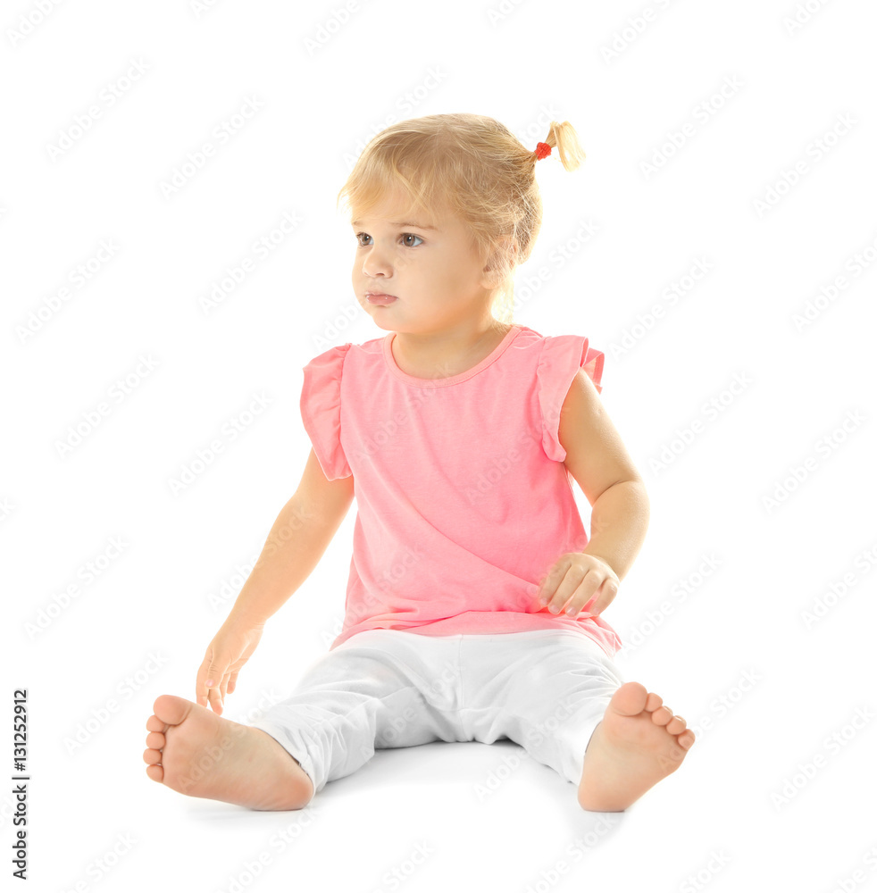 Adorable little girl sitting on white background Adorable little girl sitting on white background