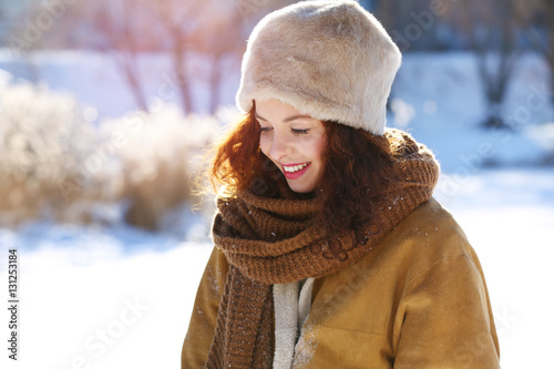 Beautiful young woman outdoors on winter day