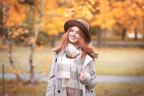 Beautiful young woman in a autumn park