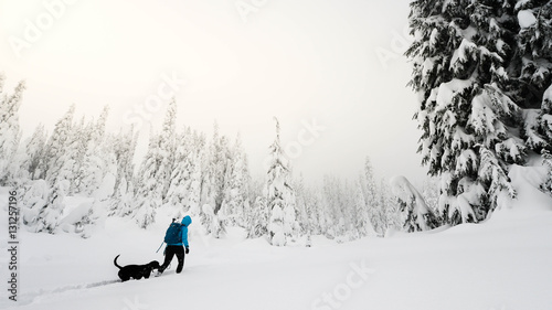 Backcountry Snowshoe with black dog