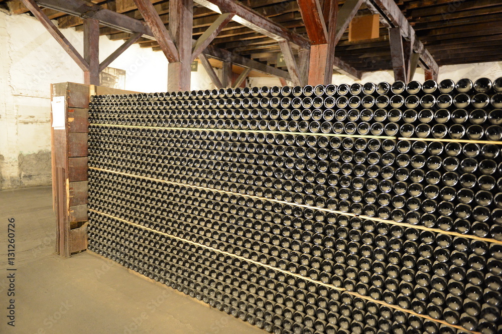 Obraz premium A bottle of wine in the cellars of the winery.