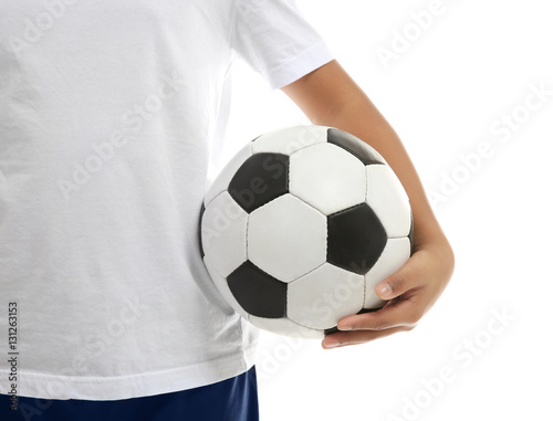Young soccer player with ball on white background, closeup