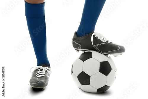 Male legs with soccer ball on white background, closeup