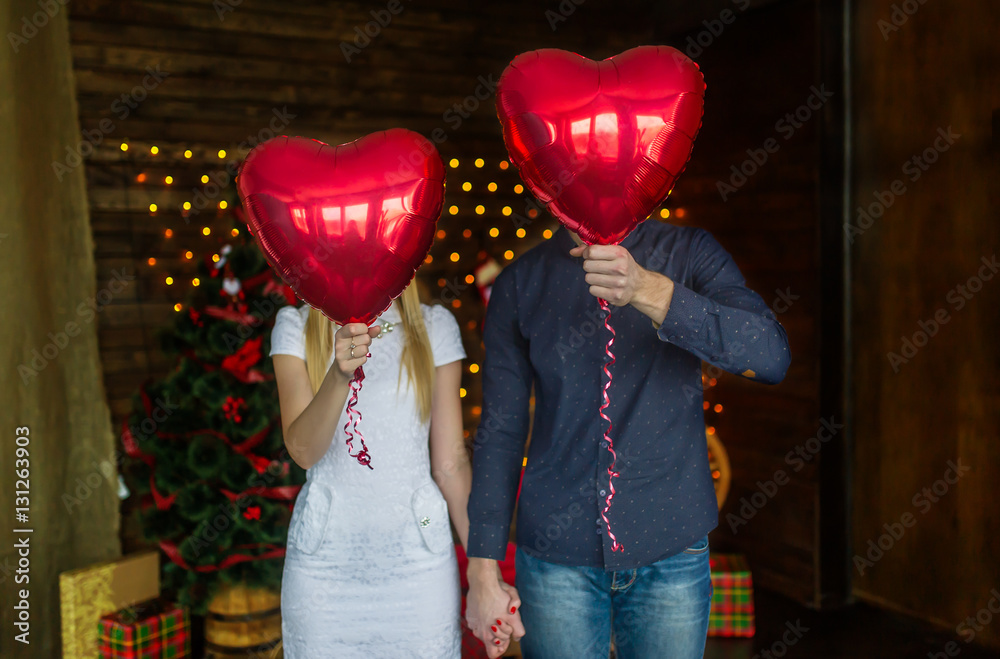 Happy couple with balloons instead of a head have fund