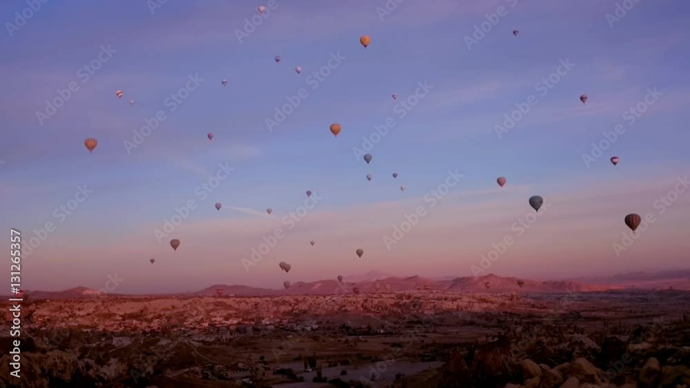 Flying hot air balloons in sunrising time Flying hot air balloons in sunrising time