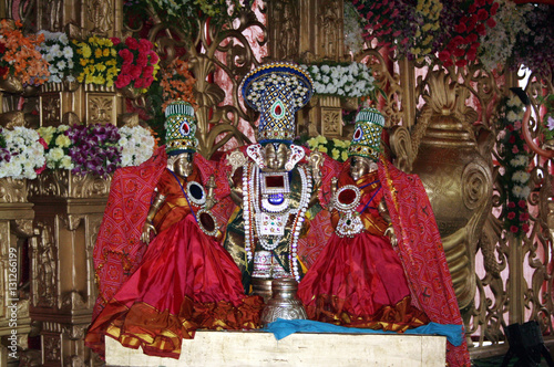 Closeup photo of idols of Indian Hindu God balaji or venkatewara with consorts 