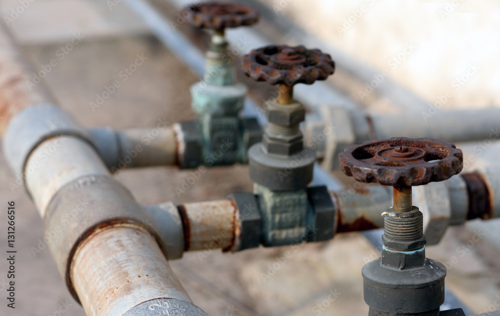 Closeup photo of a pipe and valve plumbing concept Closeup photo of a pipe and valve plumbing concept