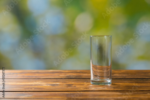 Empty glass on wooden table outdoor