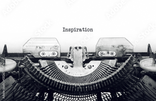 Vintage typewriter on white background with text Inspiration
