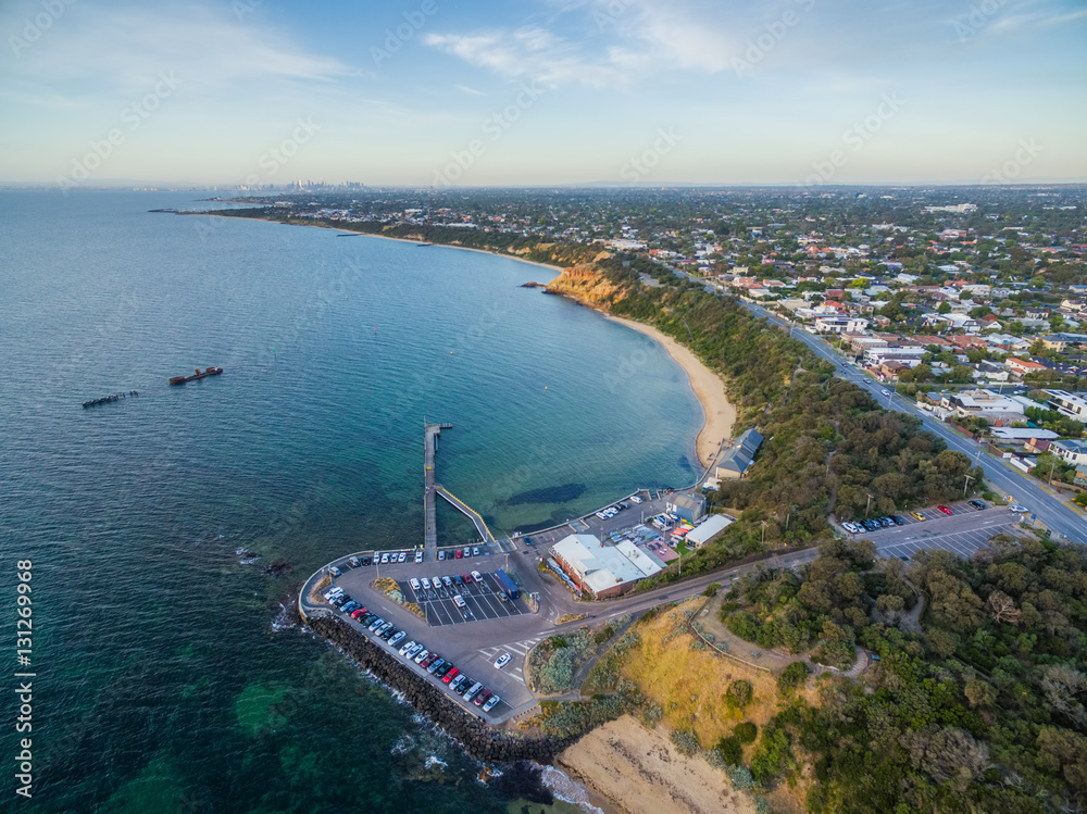 Aerial view of Black Rock pier, yacht club, and historic shipwreck of HMVS cerberus at sunset. Melbourne. Victoria, Australia