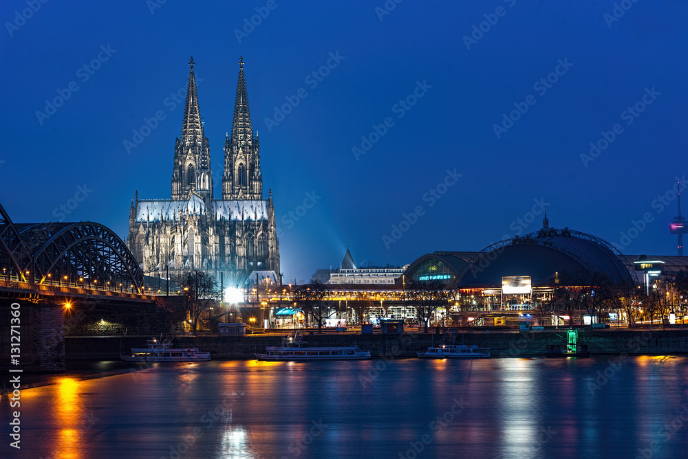 Bridge over the Rhine river in Cologne at the early morning blue hours sun light