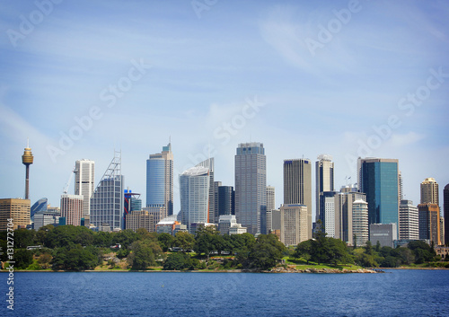 Dramatic view at Sydney city urban skyline from Western Plains with blue sky and clouds on a bright day. © Jazper4153