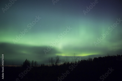 Northern lights illuminating the sky. Magical moment in Finland. Aurora borealis is beautiful phenomenon