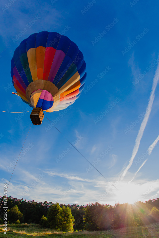 Obraz premium Colorful hot air balloon in blue sky
