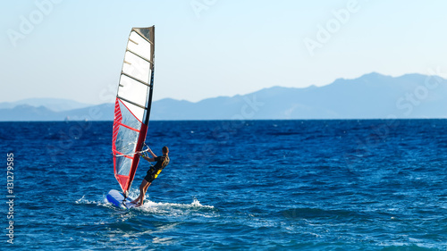 windsurfer in background of mountains in the distance. summer Sunny day. Greece, Rhodes
