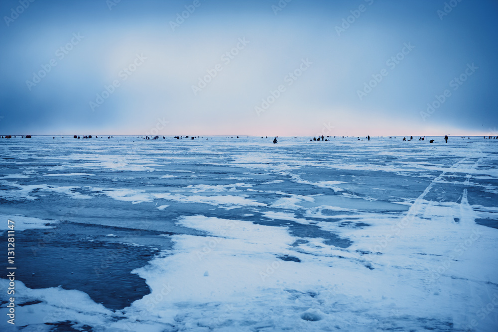Naklejka premium Dawn on the frozen Baltic Sea Biosphere polygon. Ice fishing for