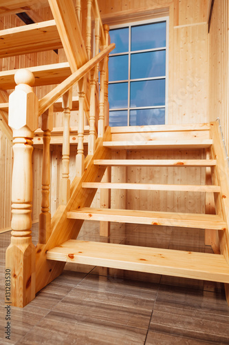 staircase and window inside of wooden house