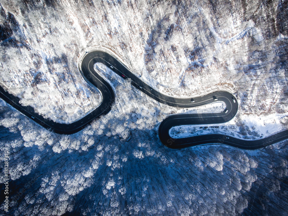 Fotobehang Luchtfoto Wegen Winding road in the middle of the winter in the high mountain pass  #131287310