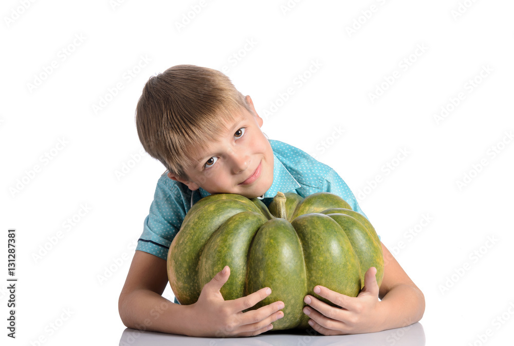 Fototapeta premium Cute boy sitting with pumpkin
