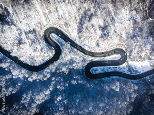 Winding road in the middle of the winter in the high mountain pass  © Calin Stan
