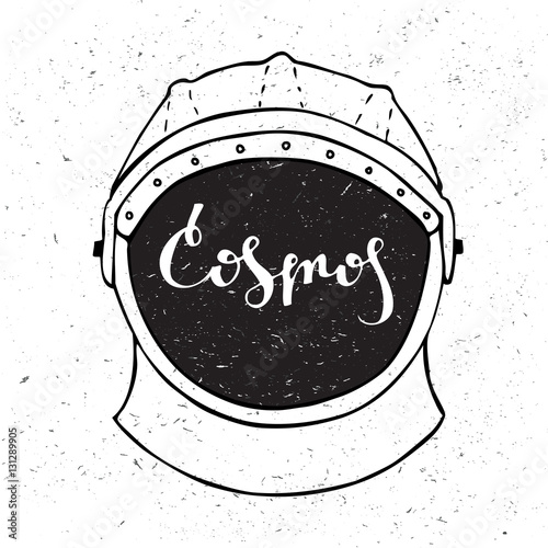 Astronaut helmet with inscription cosmos in the center.