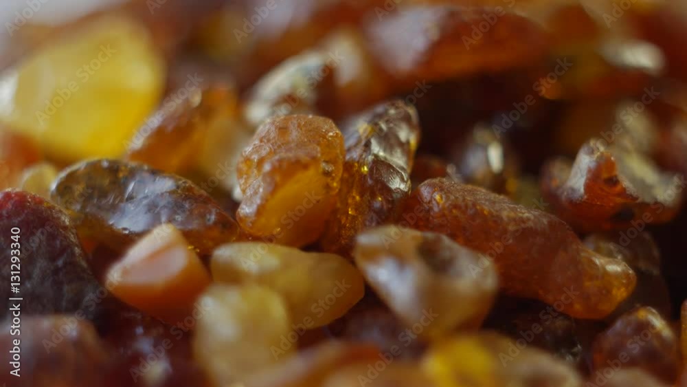 Beautiful Fiery Amber In Macro. From the Baltic Sea, Lithuania. Rotating on the table. Beautiful Fiery Amber In Macro. From the Baltic Sea, Lithuania. Rotating on the table.