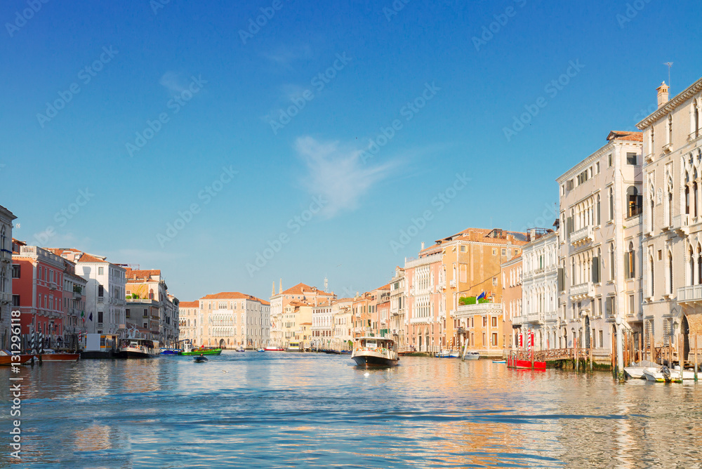 muticolored Venice houses over water of Grand canal with boats, Italy