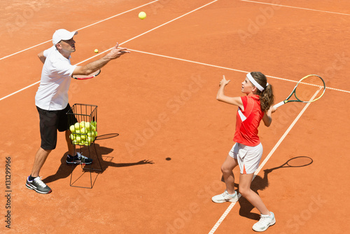 Junior tennis player in training