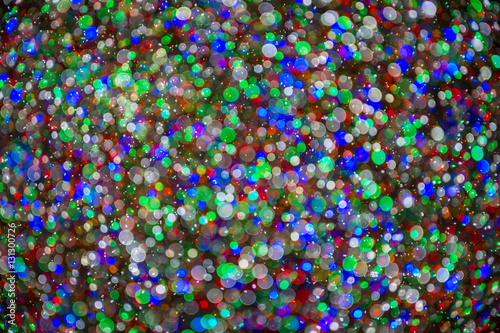 Abstract holiday Christmas lights background in colorful bokeh bubbles 