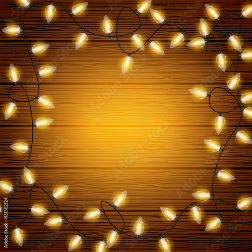 Vector Christmas lights on wooden texture background with copyspace