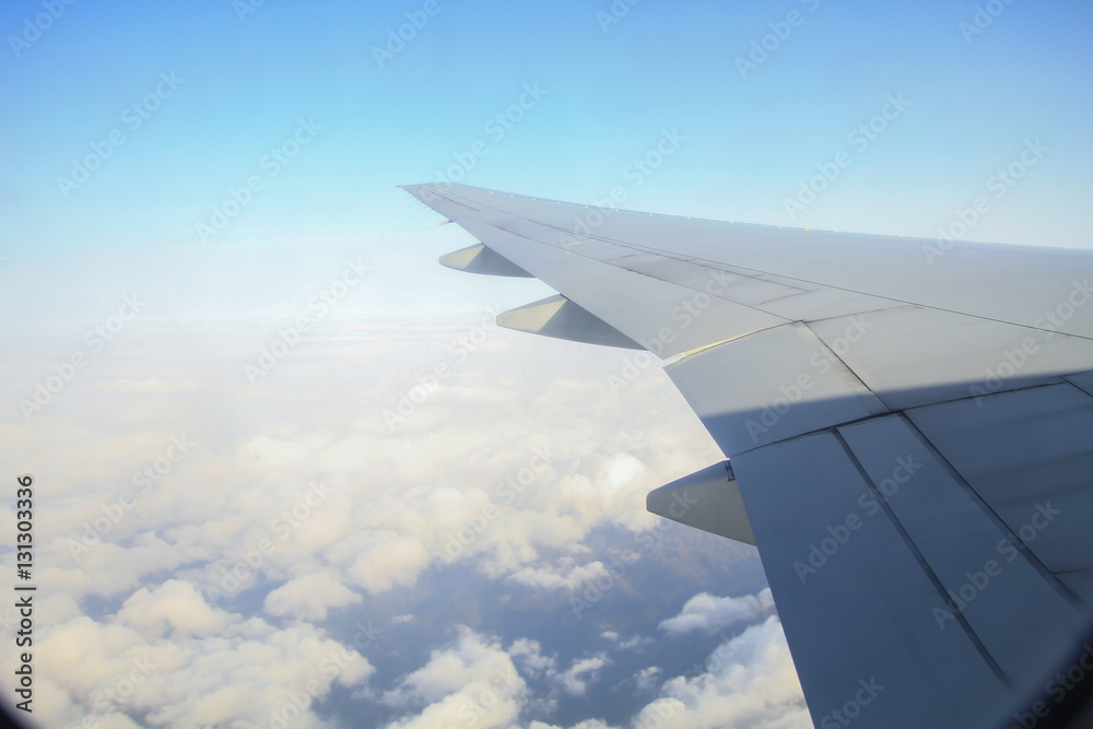 Fototapeta premium view of the aircraft wing on the sky