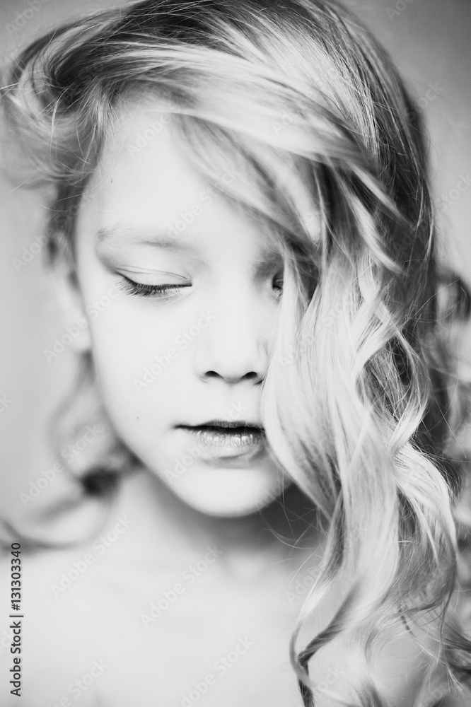Portrait of a pretty little girl with closed eyes. Portrait of a pretty little girl with closed eyes.