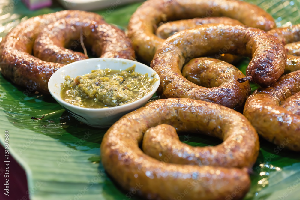 northern thai style sausages served with chili paste dip on banana leaf northern thai style sausages served with chili paste dip on banana leaf