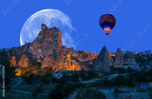 Hot air balloon flying over spectacular Cappadocia "Elements of this image furnished by NASA"