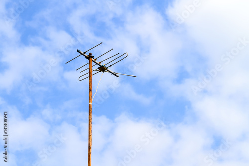 old television antenna over a blue sky © nitimongkolchai