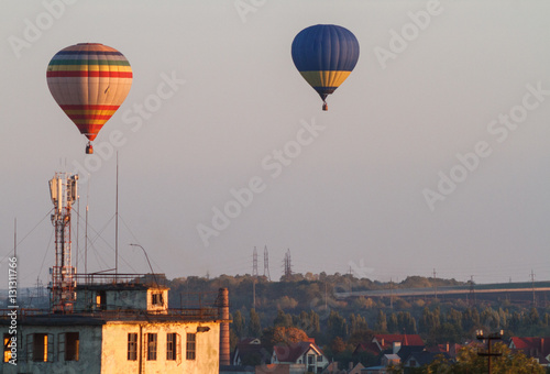 Colorful hot-air balloons flying over the mountain