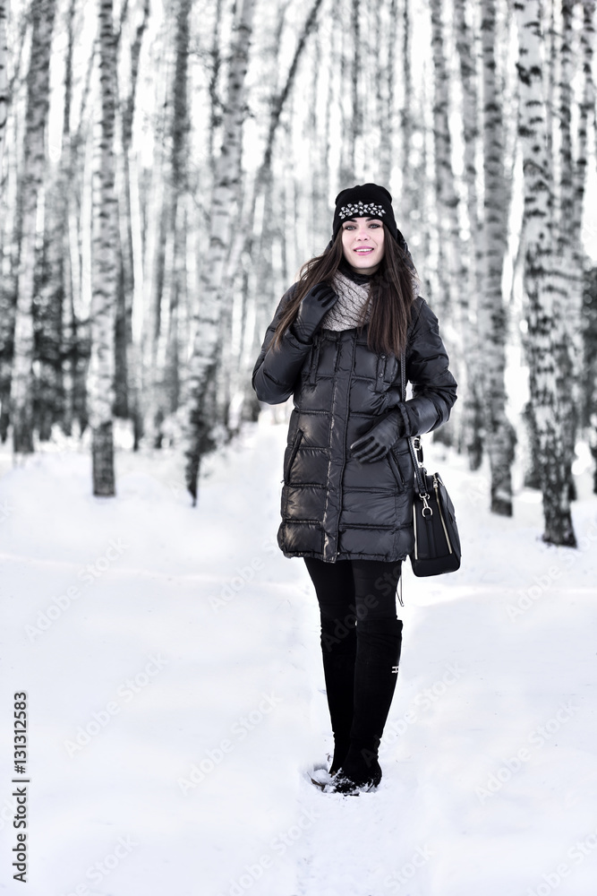 Girl with dark long hair in the winter park Girl with dark long hair in the winter park
