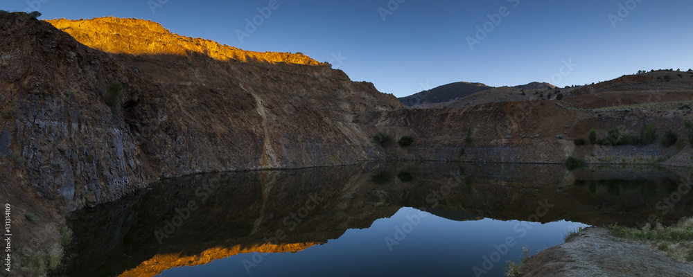 Obraz premium Old mine near Virginia City Nevada now filled with water and fish.