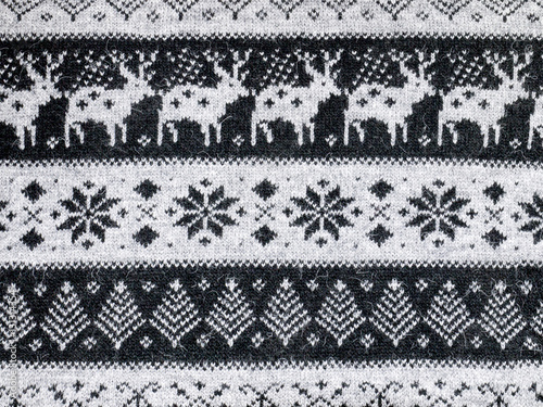 black and white ornament with yellow background on the sweater for the new year and Christmas