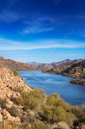 View of Canyon Lake from the Apache Trail looking down to the marina and mountains beyond
