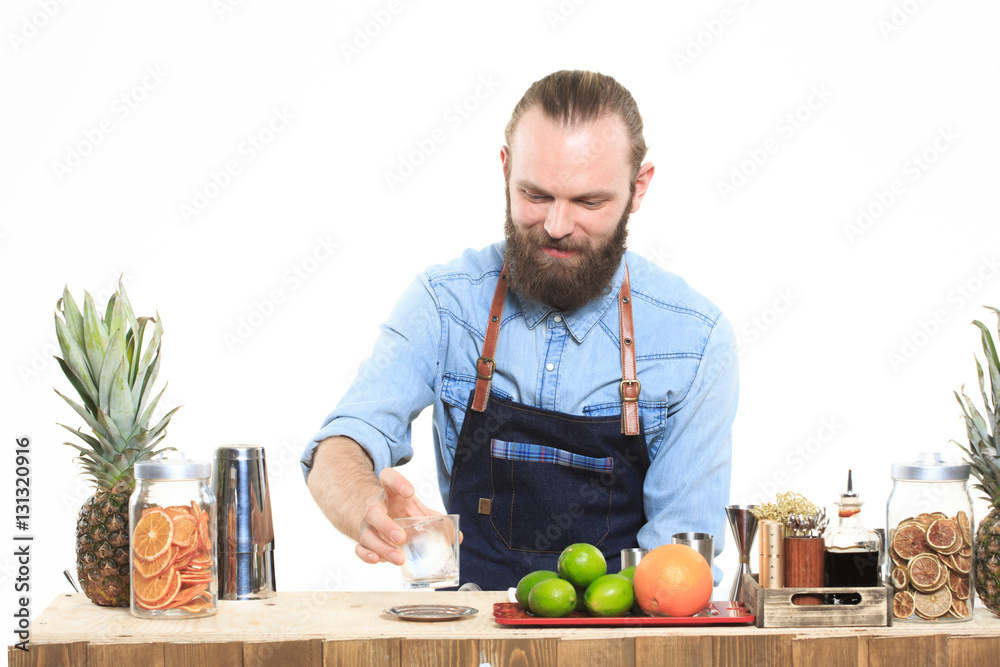 Fototapeta premium bartender with a shaker and bottle. behind the bar
