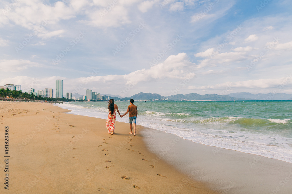 couple relax on beach together