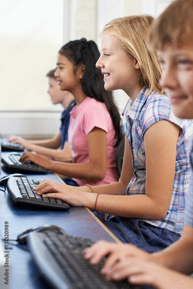 Female Elementary Pupil In Computer Class Female Elementary Pupil In Computer Class
