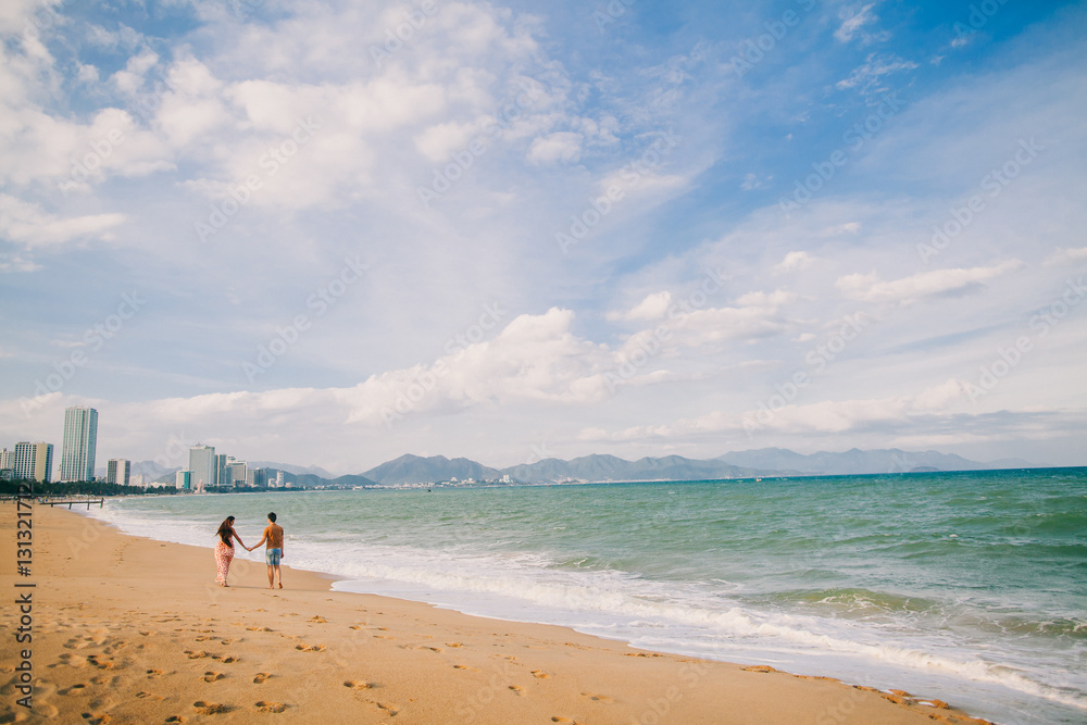 couple relax on beach together couple relax on beach together