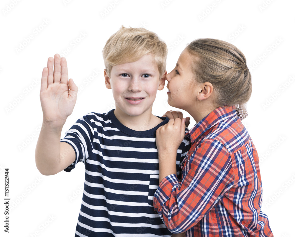 Caucasian boy pushing an imaginary button and girl whispering ear, white background Caucasian boy pushing an imaginary button and girl whispering ear, white background