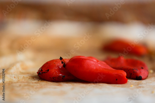 Closeup of a pile of freshly baked piquillo peppers on a rag, in Lodosa, Spain photo