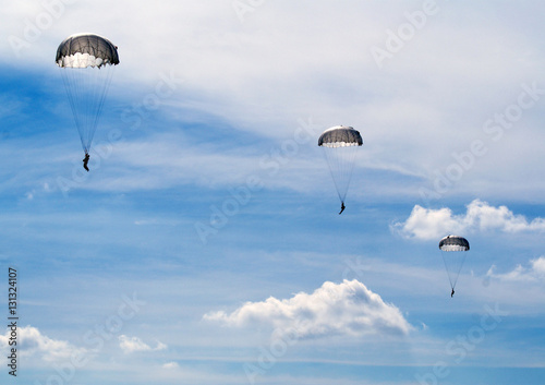 parachutists in the blue sky