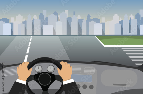 Hands on the wheel of a car