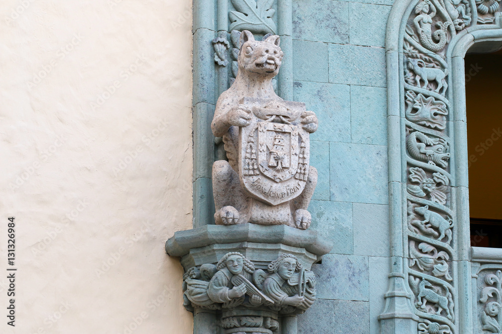 Animal stone frieze on a column.
